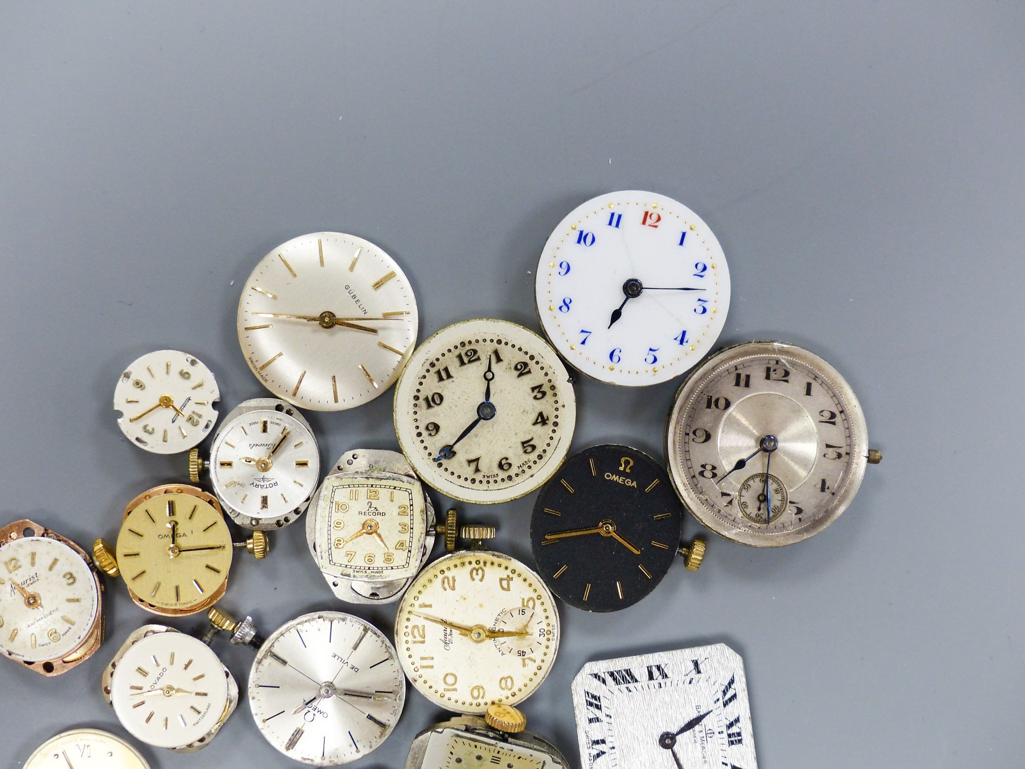 A small quantity of wrist watch movements including Baume & Mercier, Omega and Rotary.